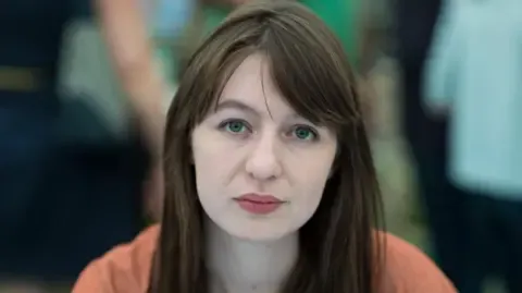 Irish author Sally Rooney states she cannot enter the UK over legal concerns